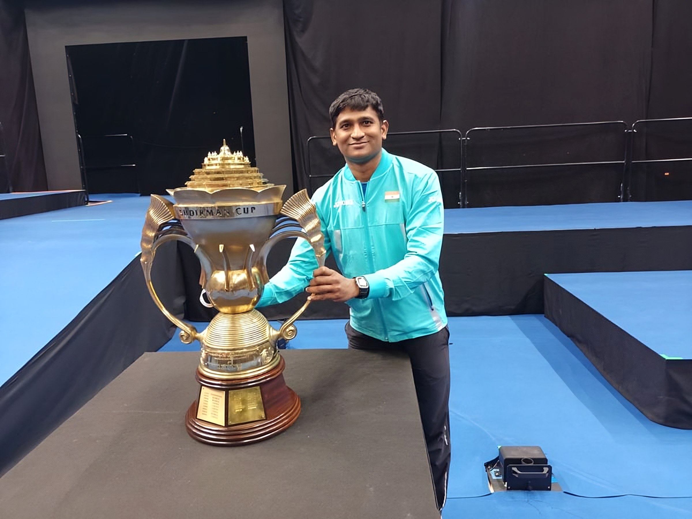 Lomada Raju beside the Sudirman Cup trophy